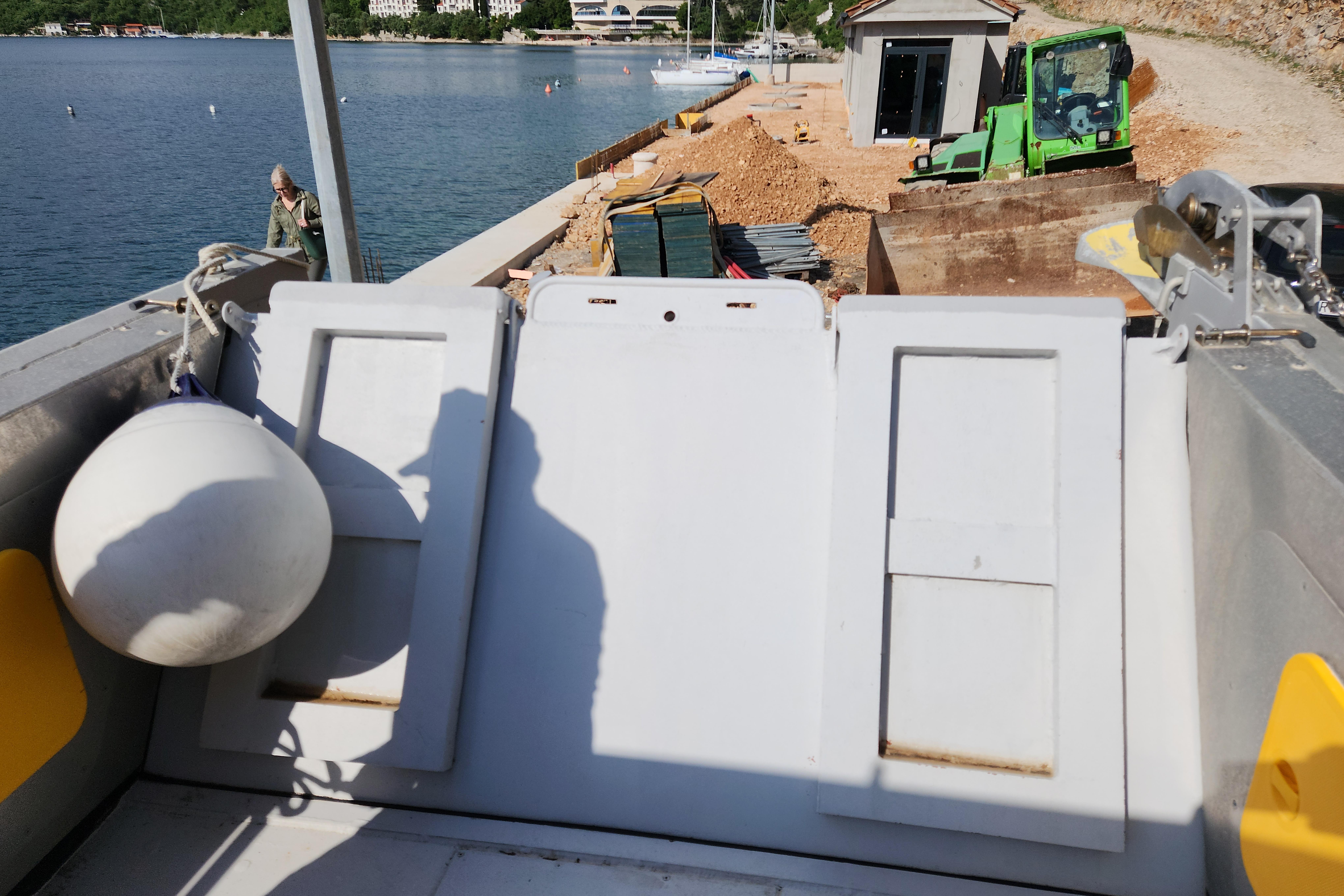 Boat deck view with construction site and water, featuring ALUTEH LC 853, 2018 model.