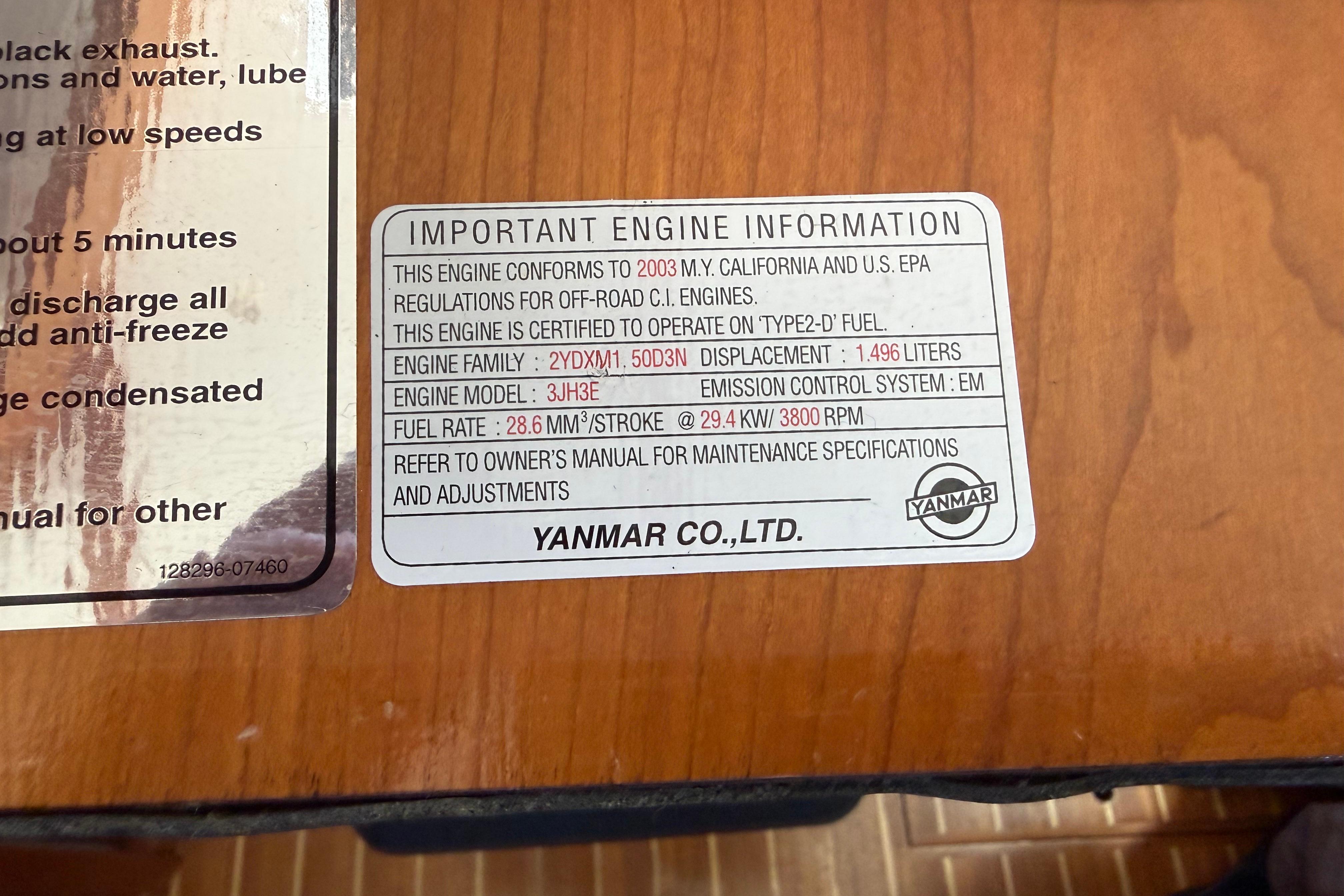 Engine information label on a 2004 Sabre 386, detailing Yanmar specifications and compliance.
