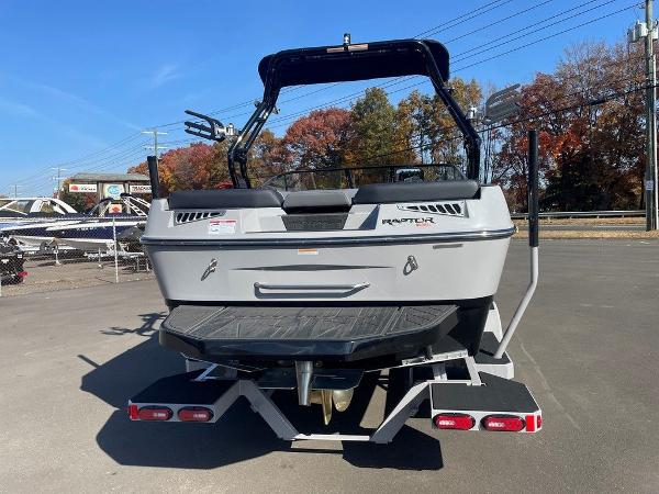 2025 Moomba Mondo boat, rear view, parked outdoors on a sunny day.