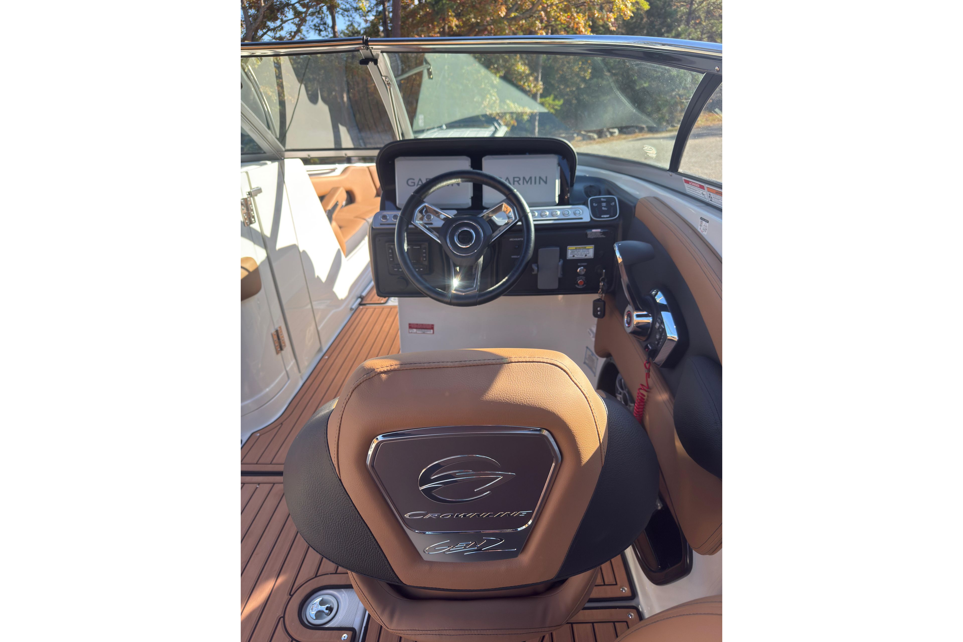 2026 Crownline 298 SS boat interior with steering wheel and dashboard.