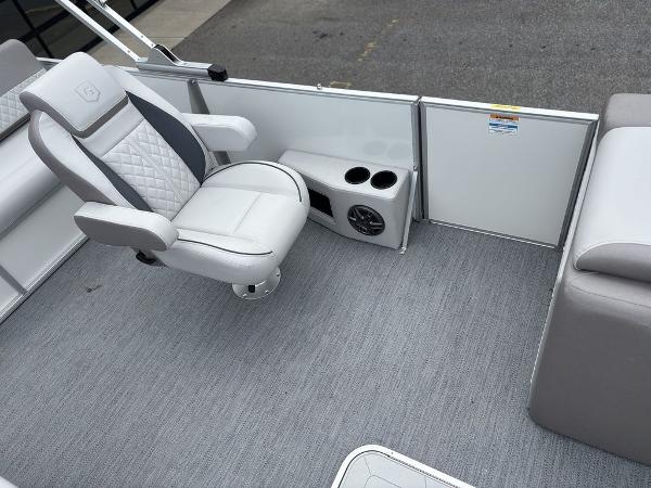 2025 Godfrey SWEETWATER 2286 SFL boat interior with swivel chair and cup holders.