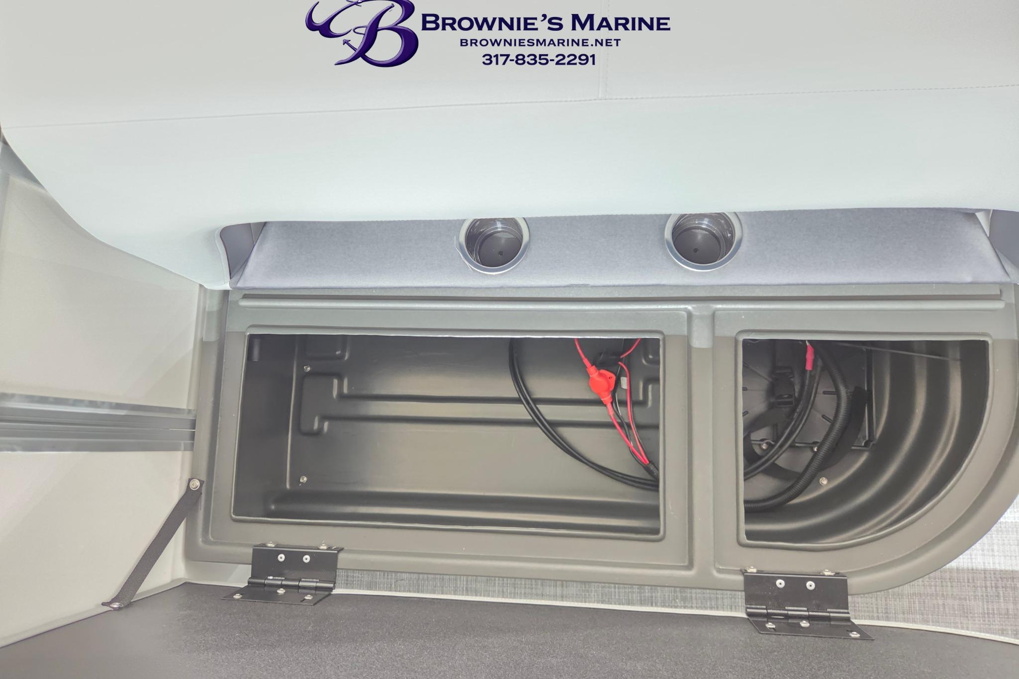 2026 Sun Tracker Party Barge 18 DLX storage compartment with wiring, showcased by Brownie's Marine.