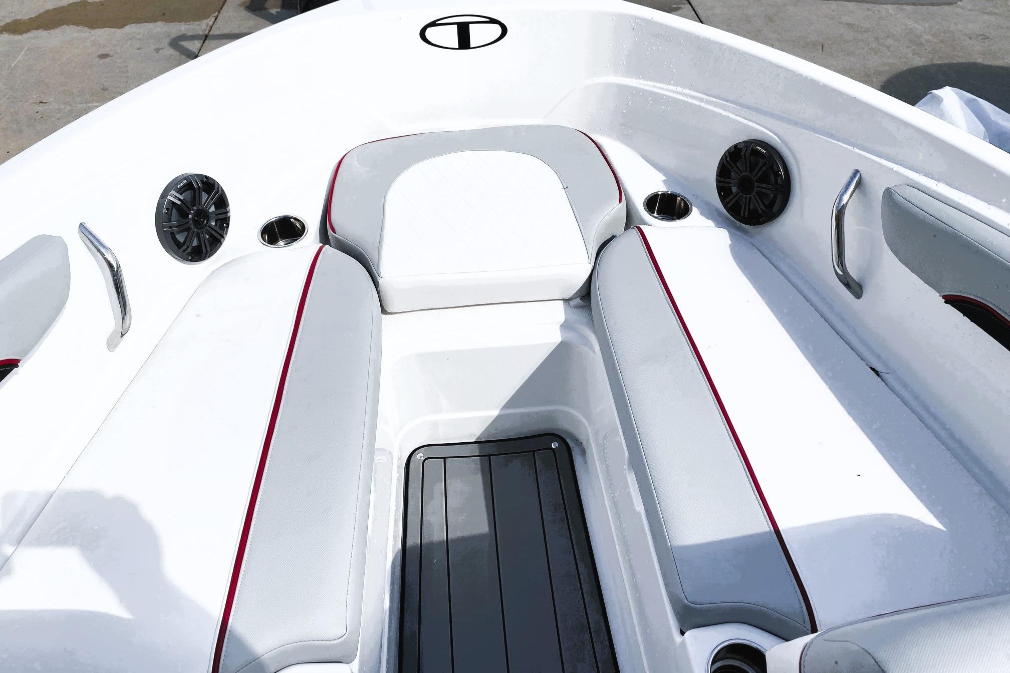 2023 Tahoe 210 Si Limited boat interior with white seating and speakers.