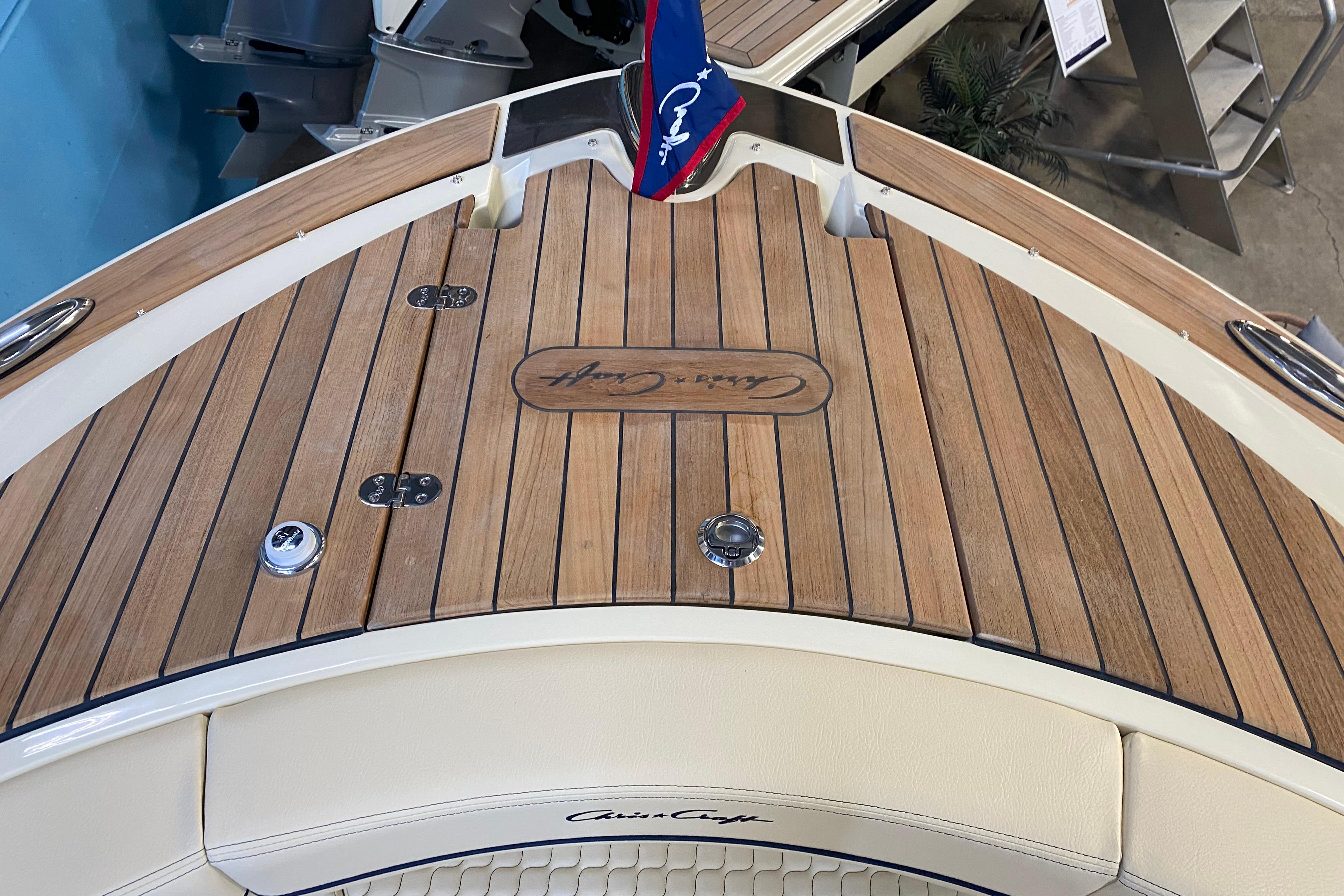 2026 Chris-Craft Launch 31 GT boat with elegant teak deck and signature logo.
