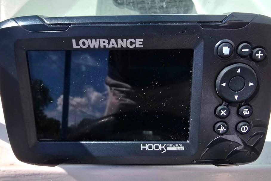 Lowrance Hook Reveal fish finder on a 1971 Jupiter 15' Tri Hull boat.