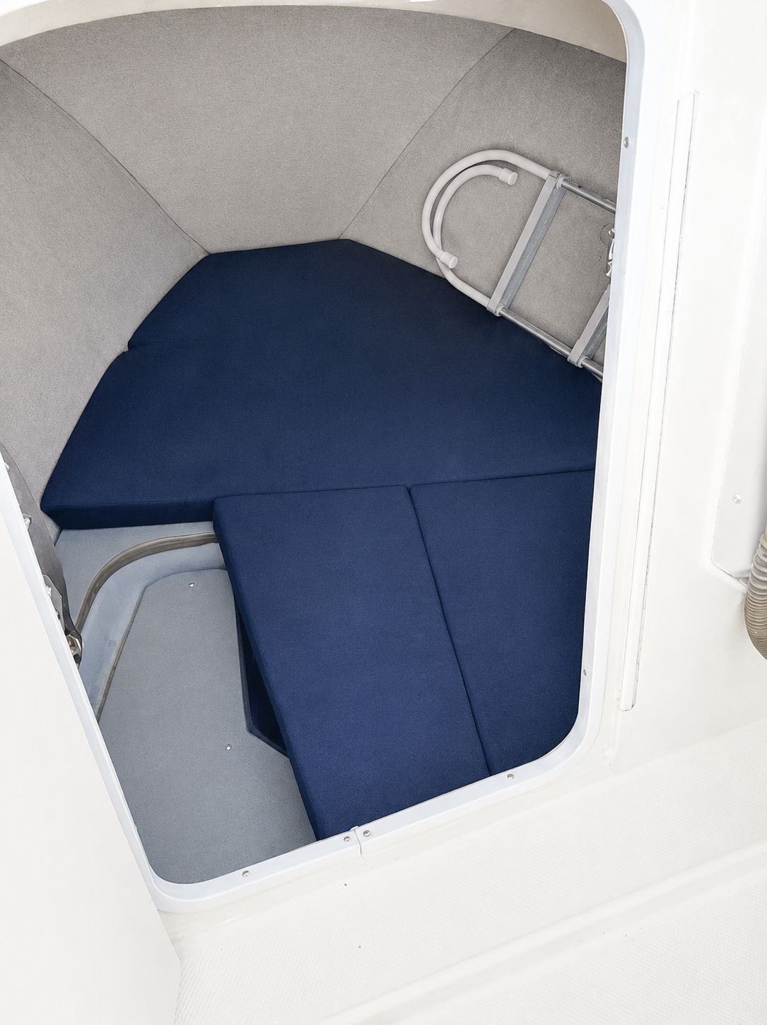 Interior of the 2007 Bayliner Trophy Pro 1902 with blue cushions.