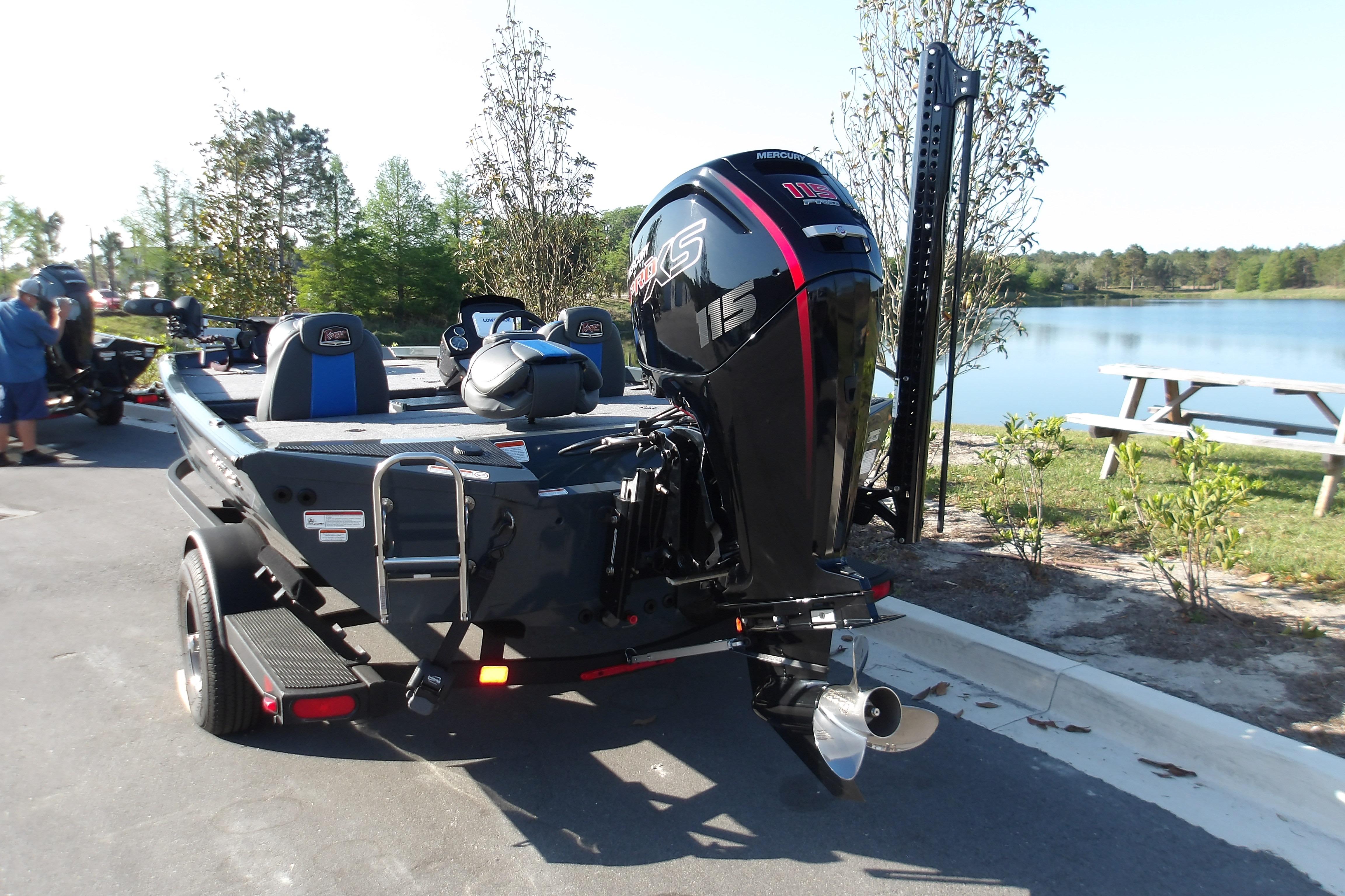 2024 Ranger RT188P boat with Mercury 115 engine, parked near a scenic lake.
