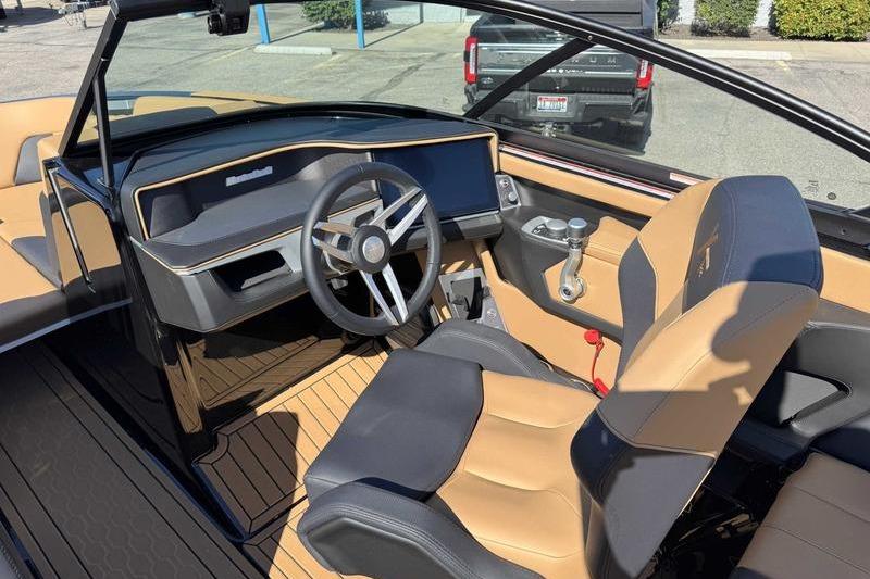 Interior of a 2026 MasterCraft XT22 boat with modern steering and seating.