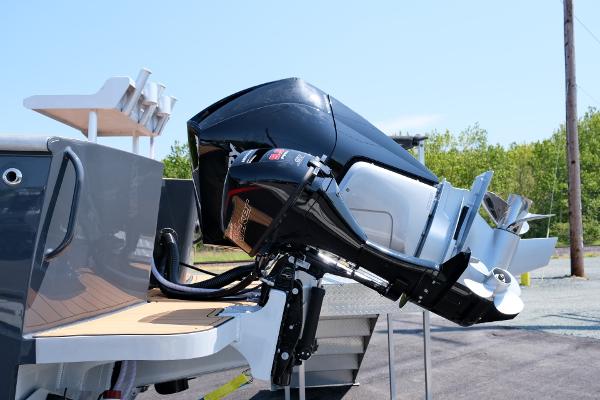 2023 Makaira Gen3 800 outboard motor on a boat, docked outdoors.