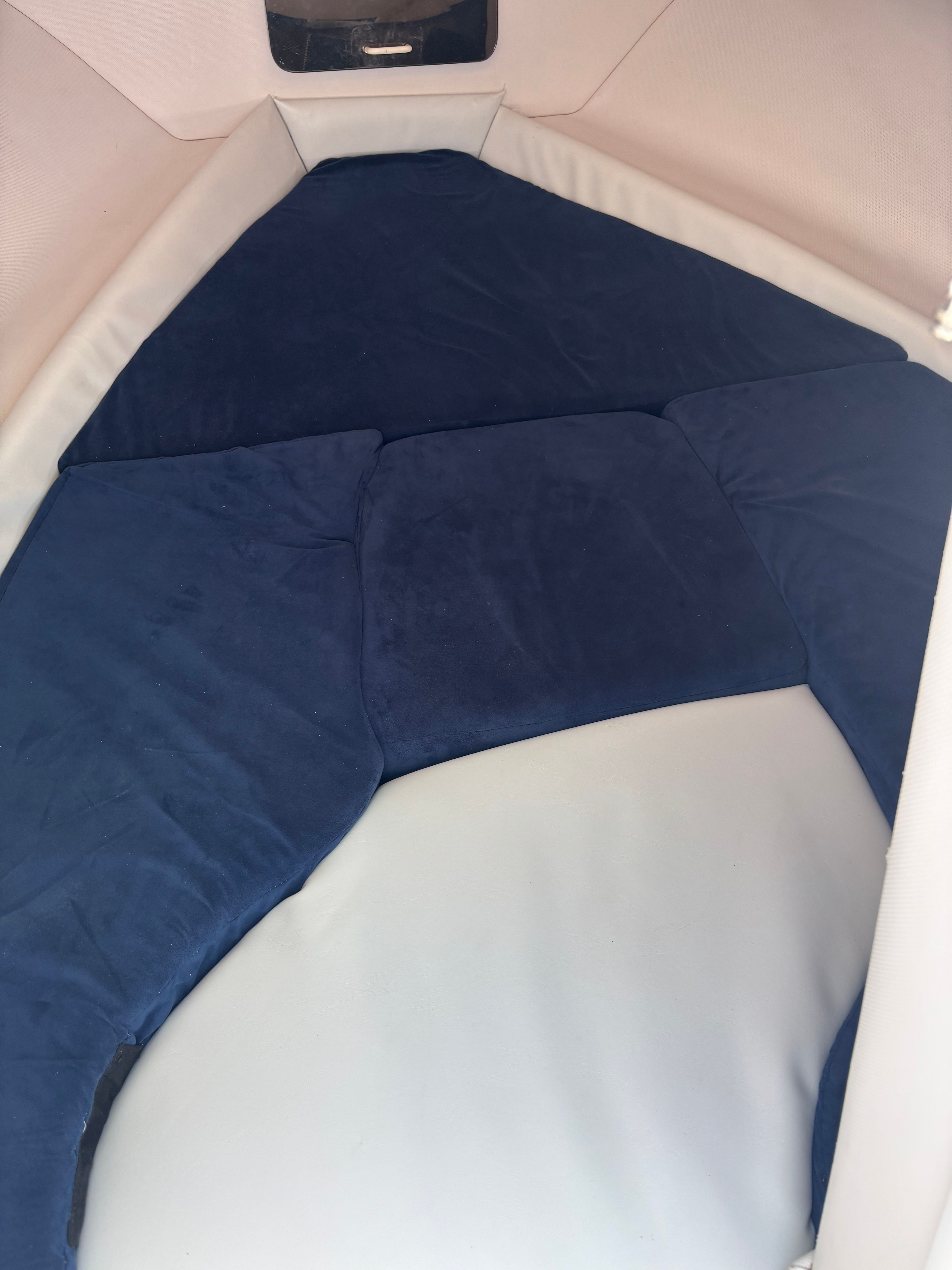 Interior of the 1999 Pro-Line 221 Walk Around with blue cushions.