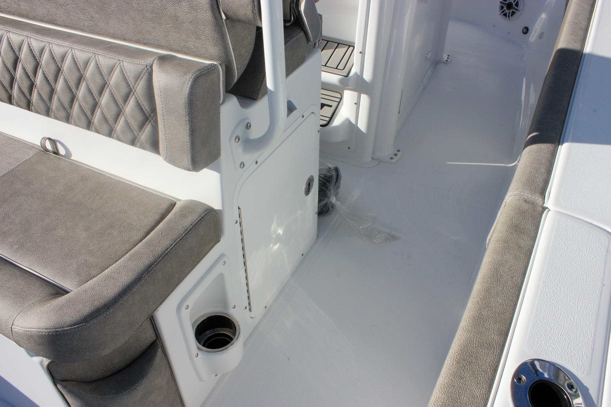 Interior view of 2026 Sea Hunt Ultra 265 SE boat with cushioned seating.