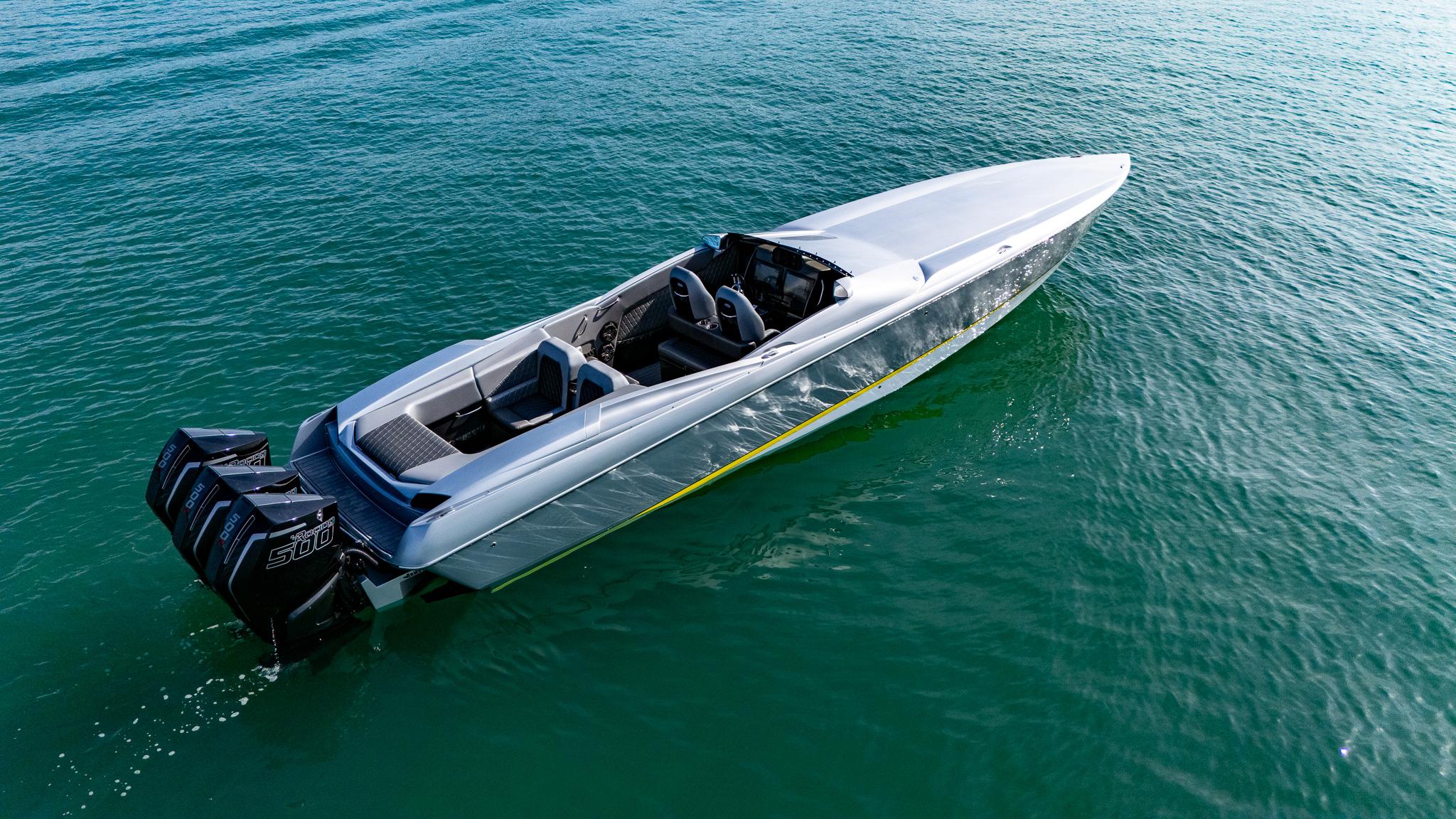 2017 Nor-Tech 3900 Super-VEE speedboat on clear water, featuring powerful outboard engines.