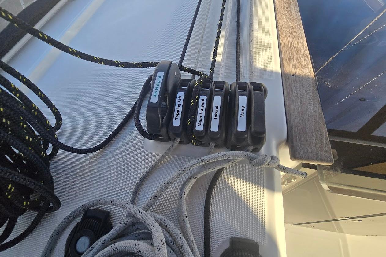 Close-up of sailing ropes and clutches on a 2023 Beneteau Oceanis 38.1 yacht.