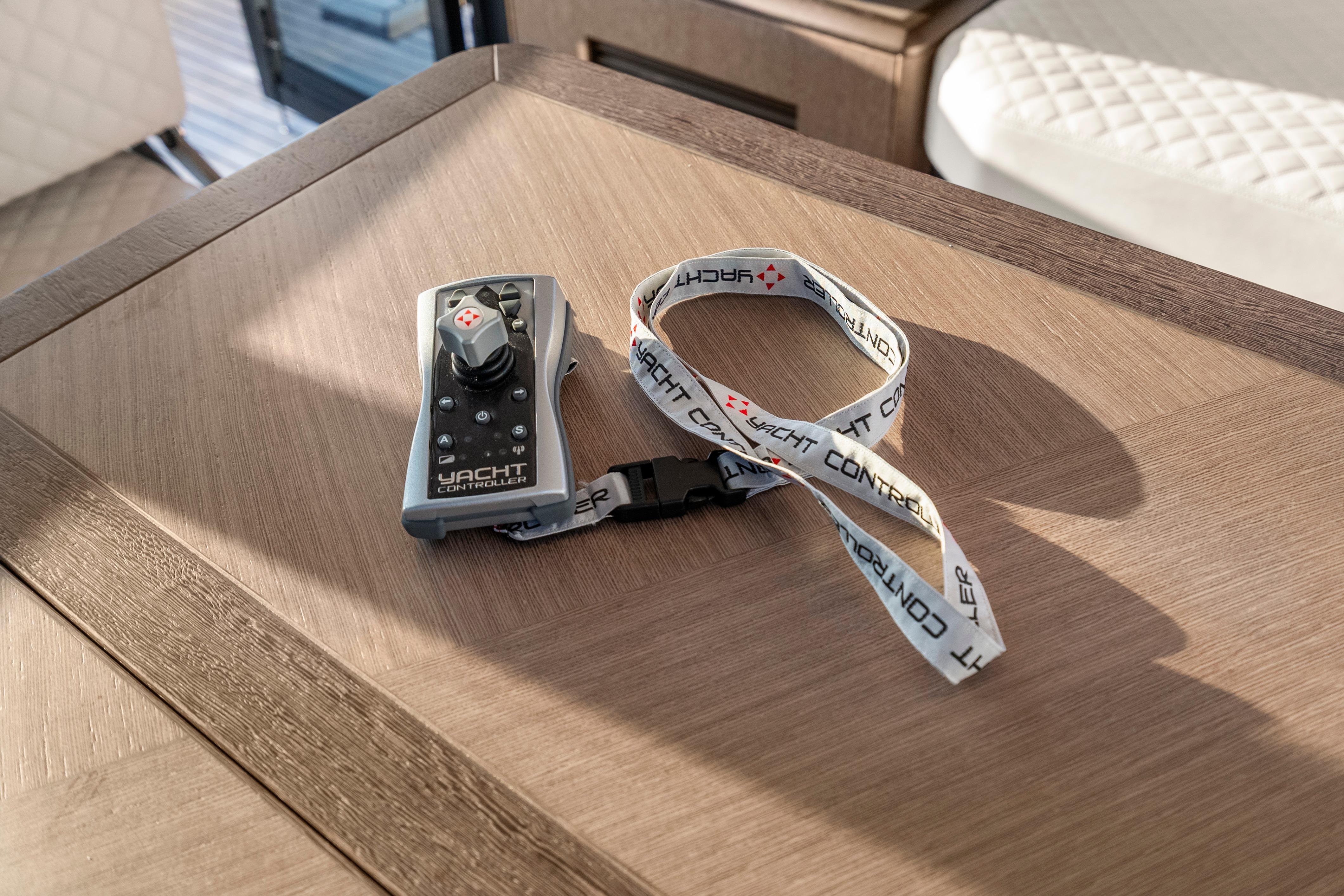 Remote control with lanyard on Galeon 400 Fly yacht table, 2023 model.