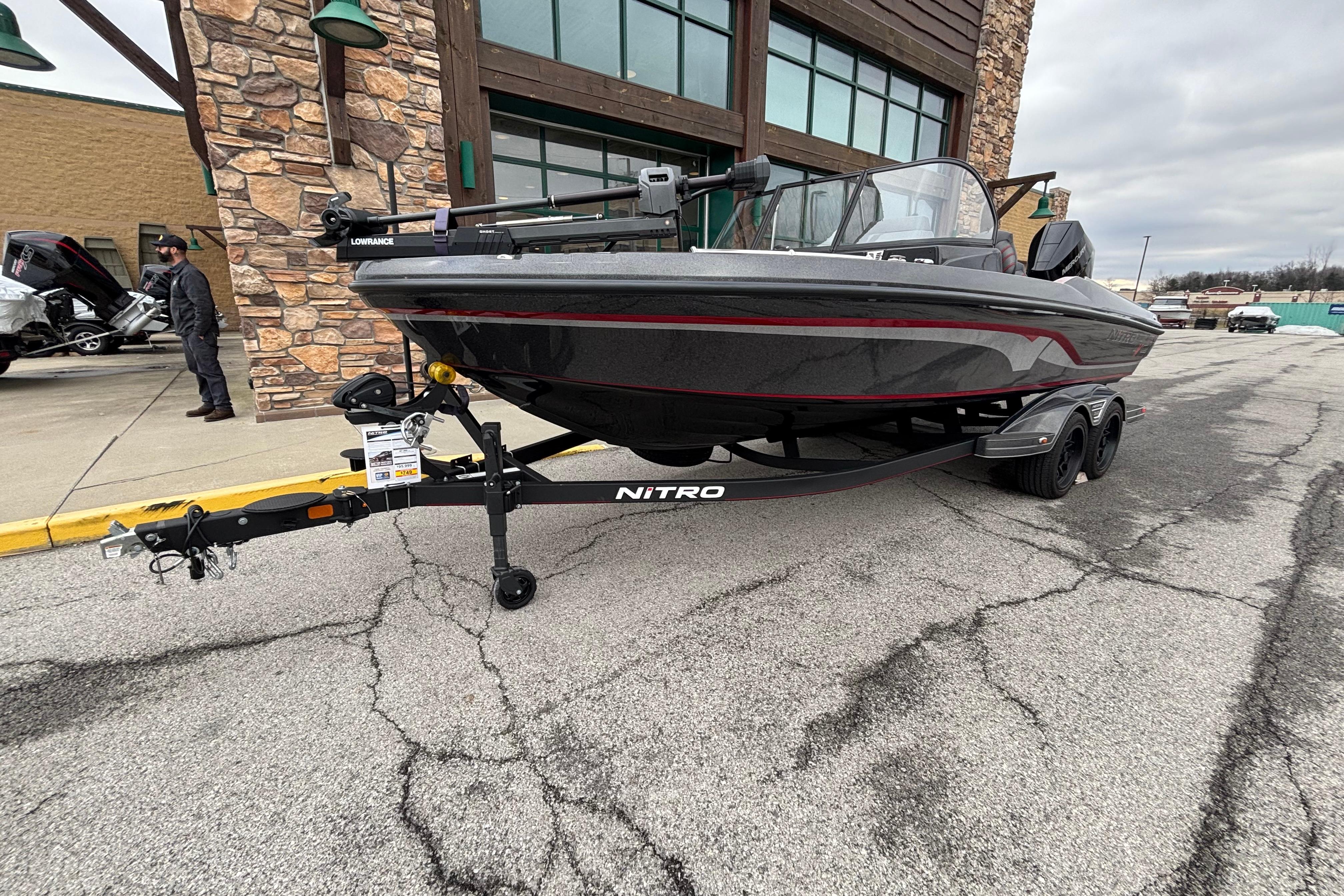 2024 Nitro ZV21 Pro boat on trailer outside a building.