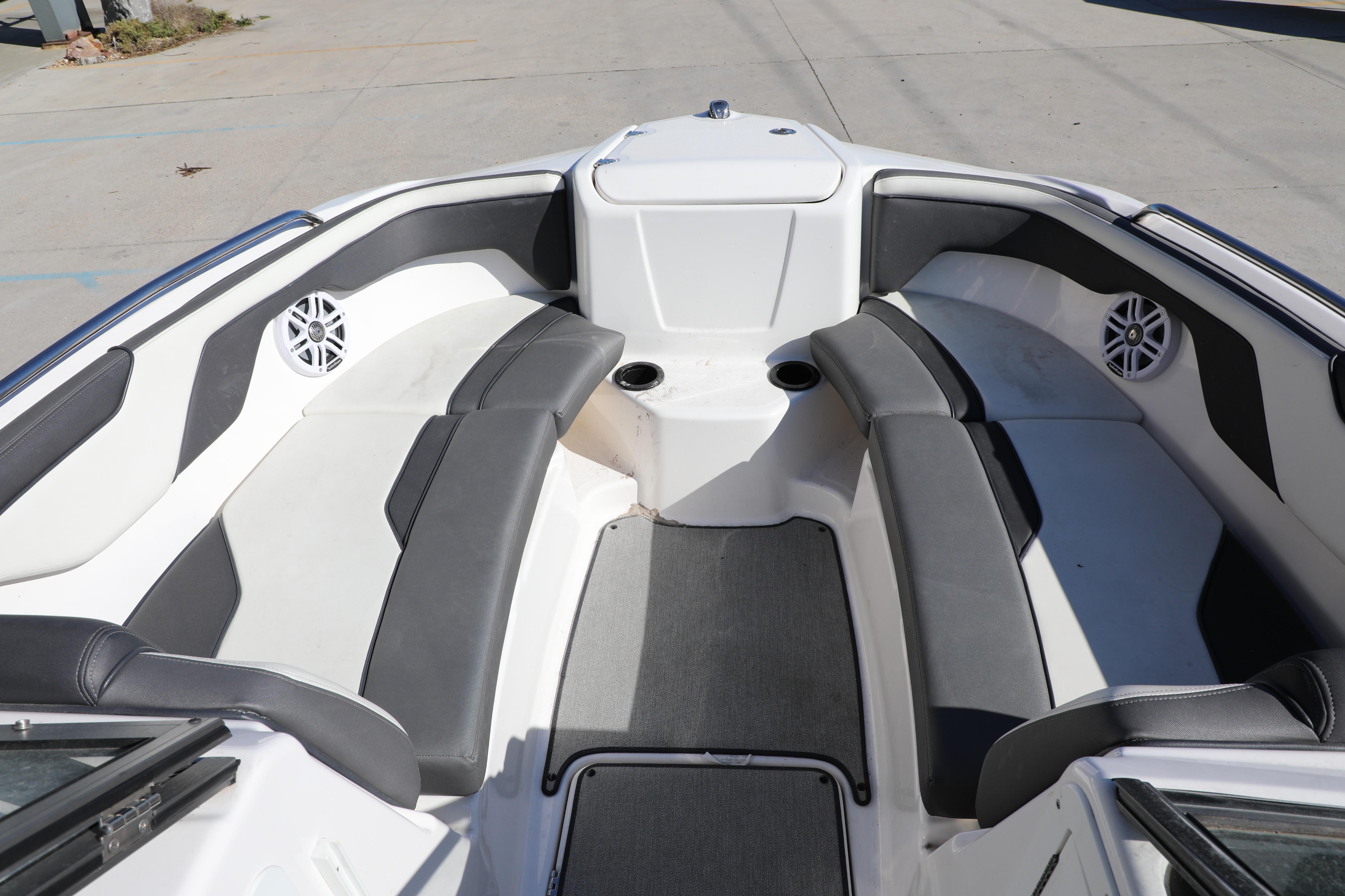 2022 Yamaha Boats AR210 interior with gray seating and cup holders.