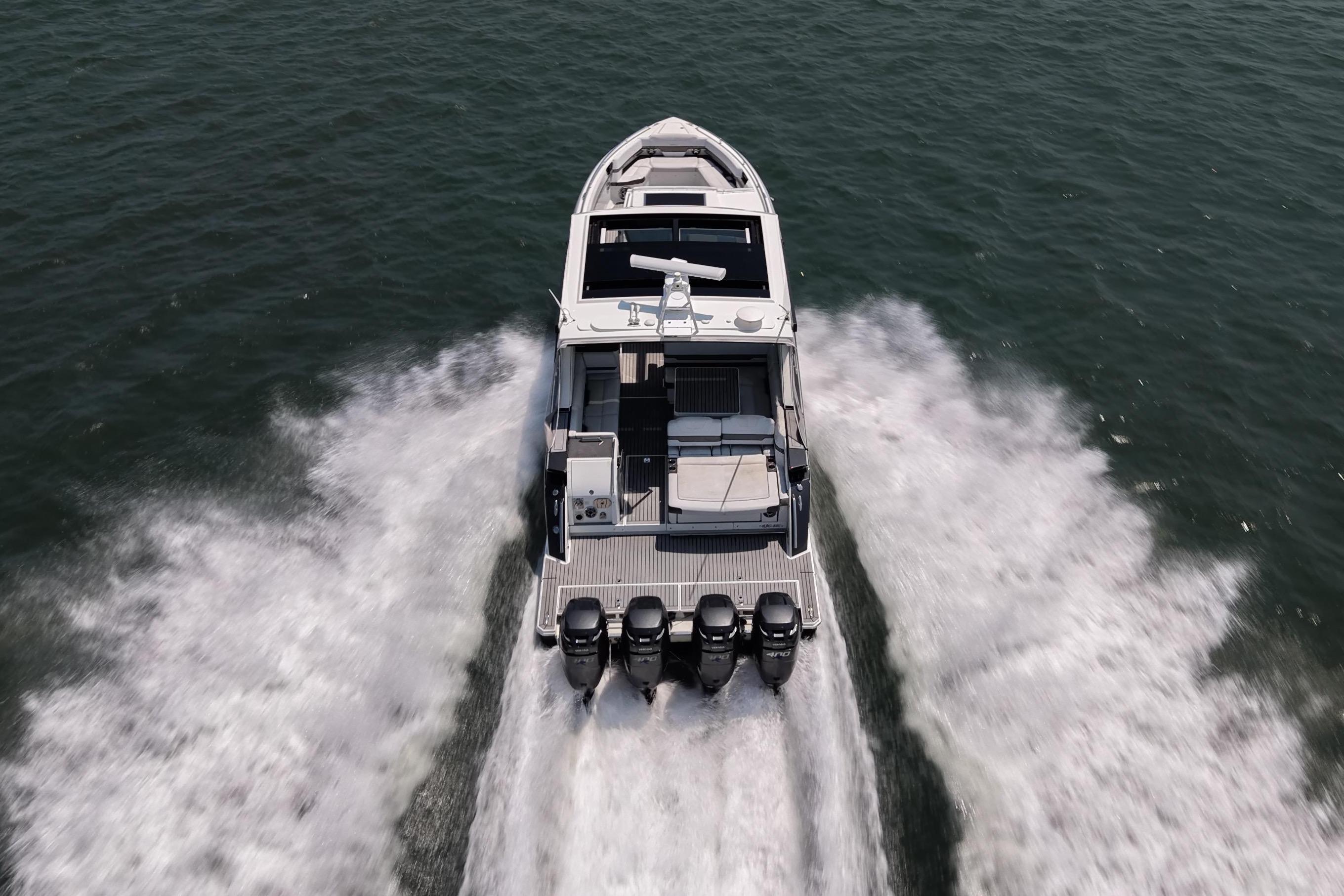 2019 Formula 430 Super Sport Crossover speeding on open water, aerial view.