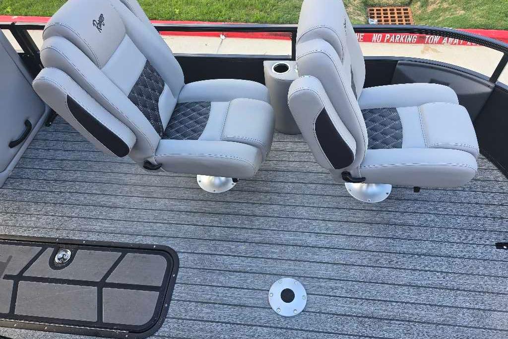 2026 Ranger 223FC boat interior with two gray cushioned seats on a striped deck.