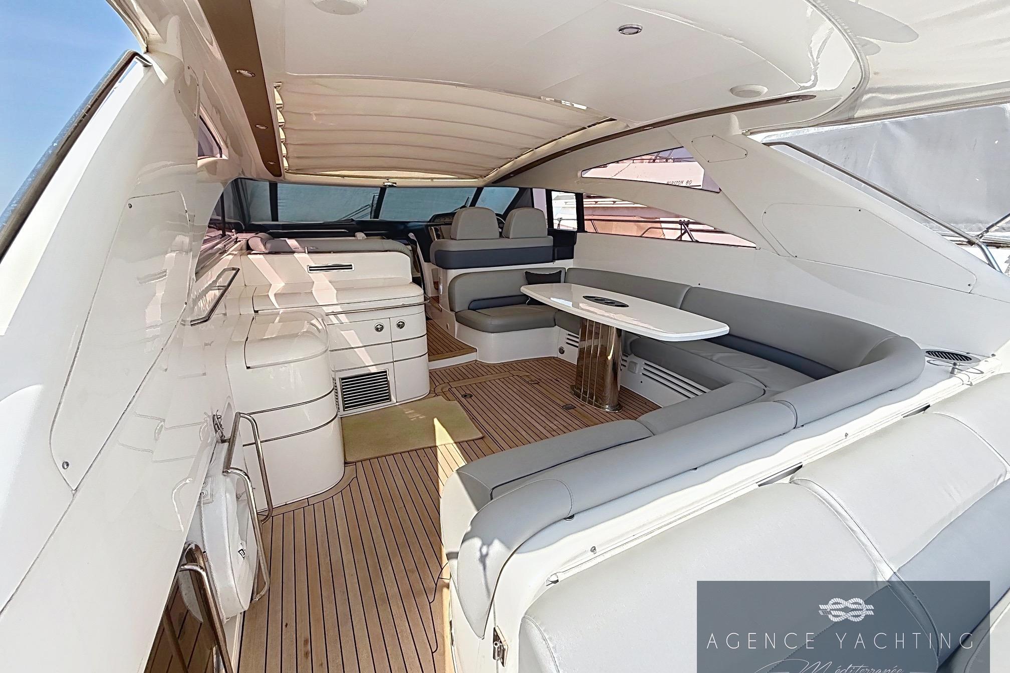 Luxurious 2004 Princess V58 yacht interior with elegant seating and modern design.