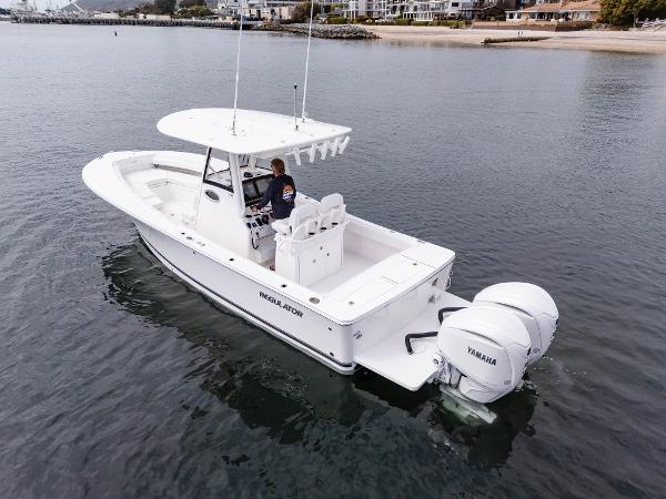 2025 Regulator 28 boat on calm water with Yamaha engine.