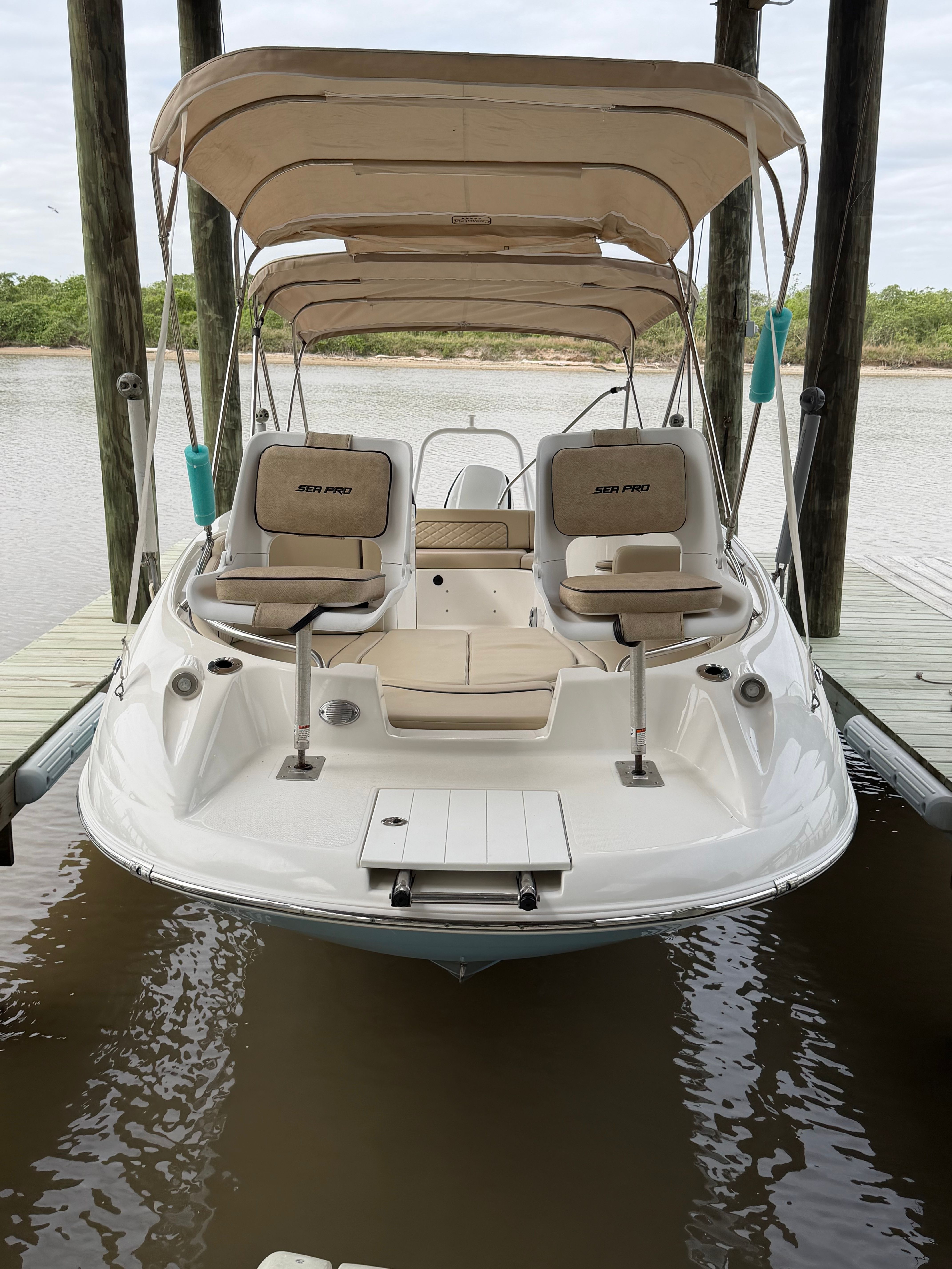 2021 Sea Pro Citation boat docked with canopy.