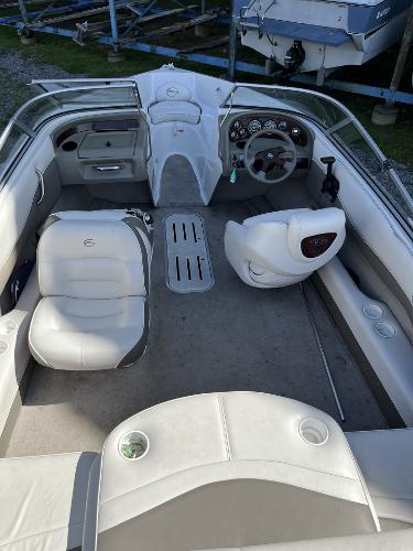 2005 Crownline 180 BR boat interior with steering wheel and seating.