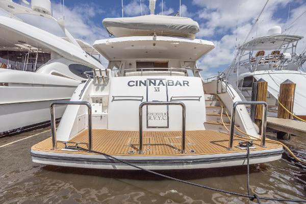 Grand Harbour 76 yacht, 2001 model, docked at marina, rear view with Cinnabar VI name.