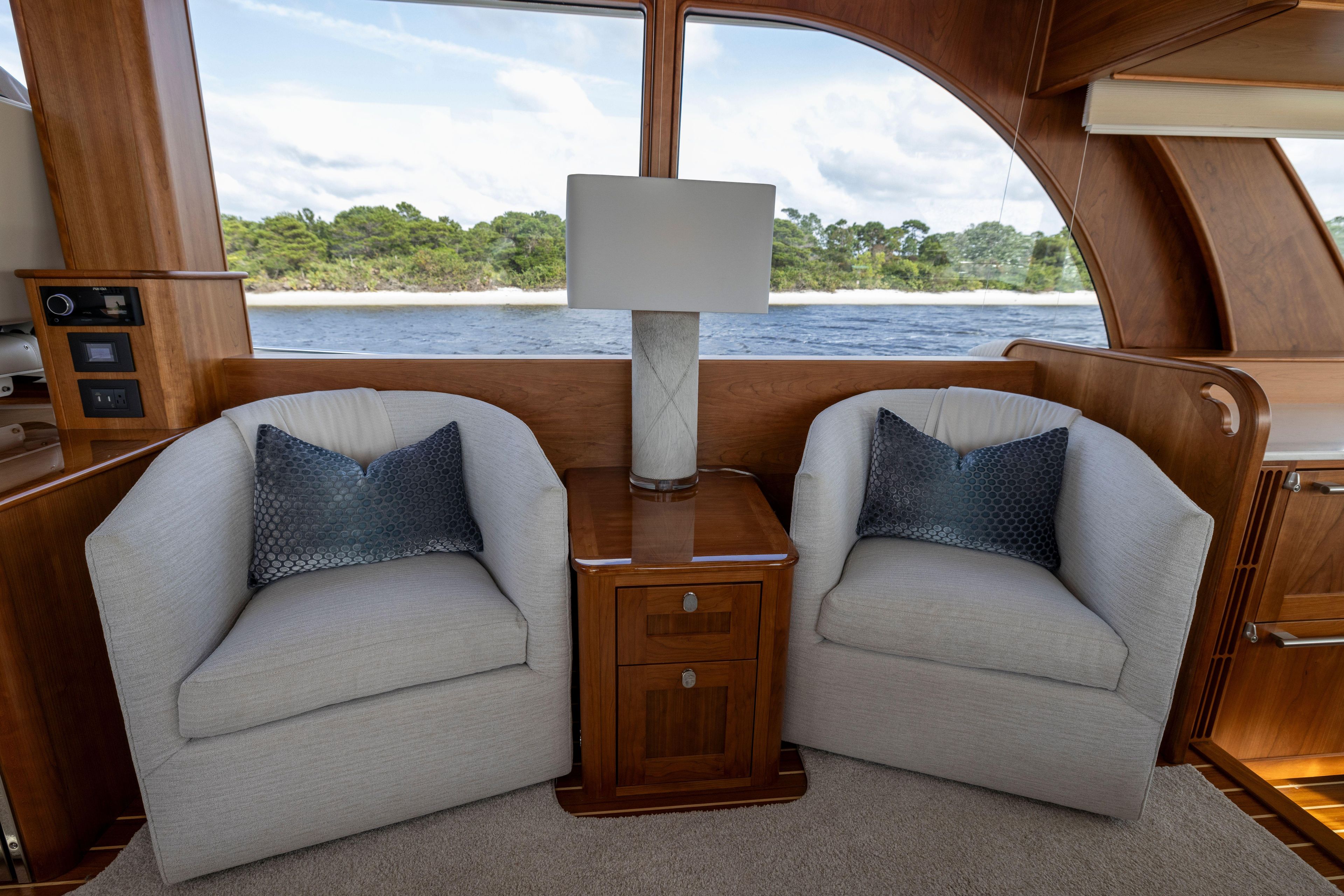 Interior of 2026 Sabre 58 Salon Express yacht with cozy seating and elegant decor.