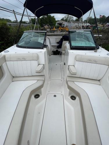 2013 Sea Ray 240 Sundeck boat interior with white seating and open deck layout.