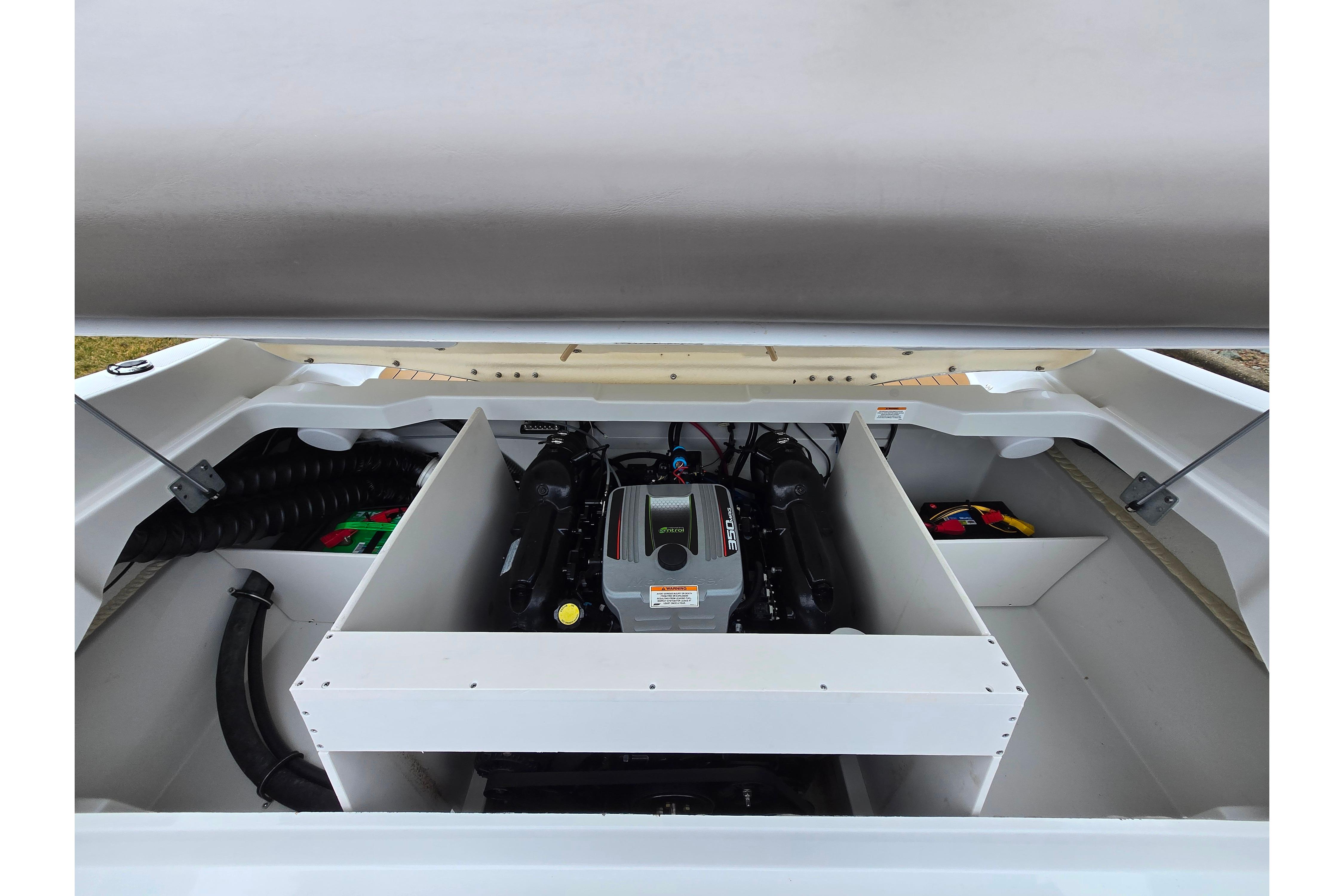 2012 Crownline 235 SS boat engine compartment, showcasing a clean and organized layout.