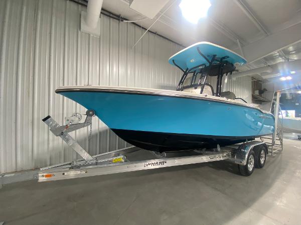 2024 Key West 219 FS boat on trailer in indoor storage.