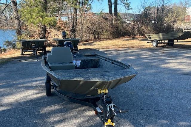 2026 Tracker Grizzly 1648 SC boat on trailer in outdoor setting.