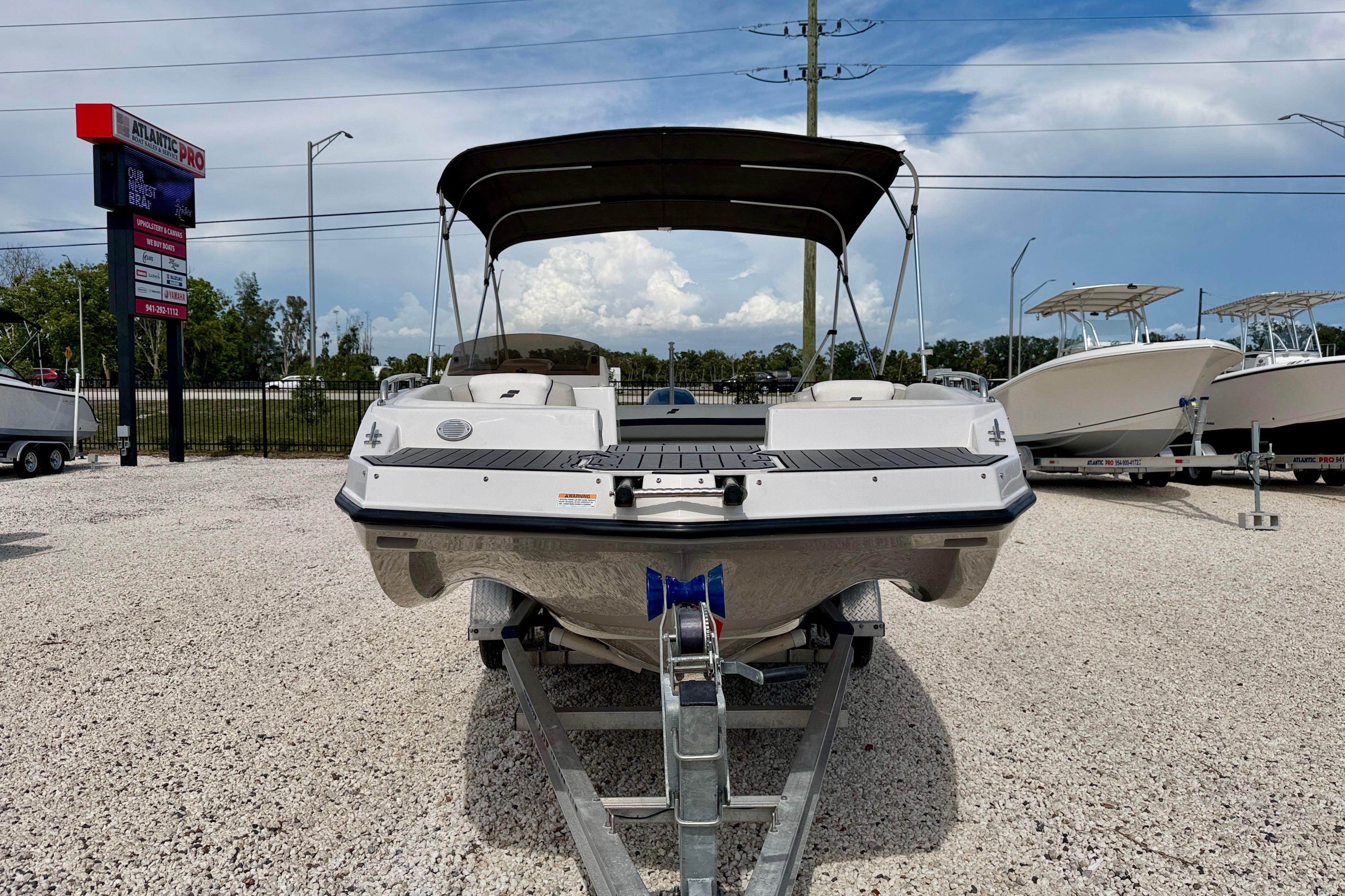 2021 Starcraft SVX 191 OB boat on trailer, displayed outdoors under a clear sky.