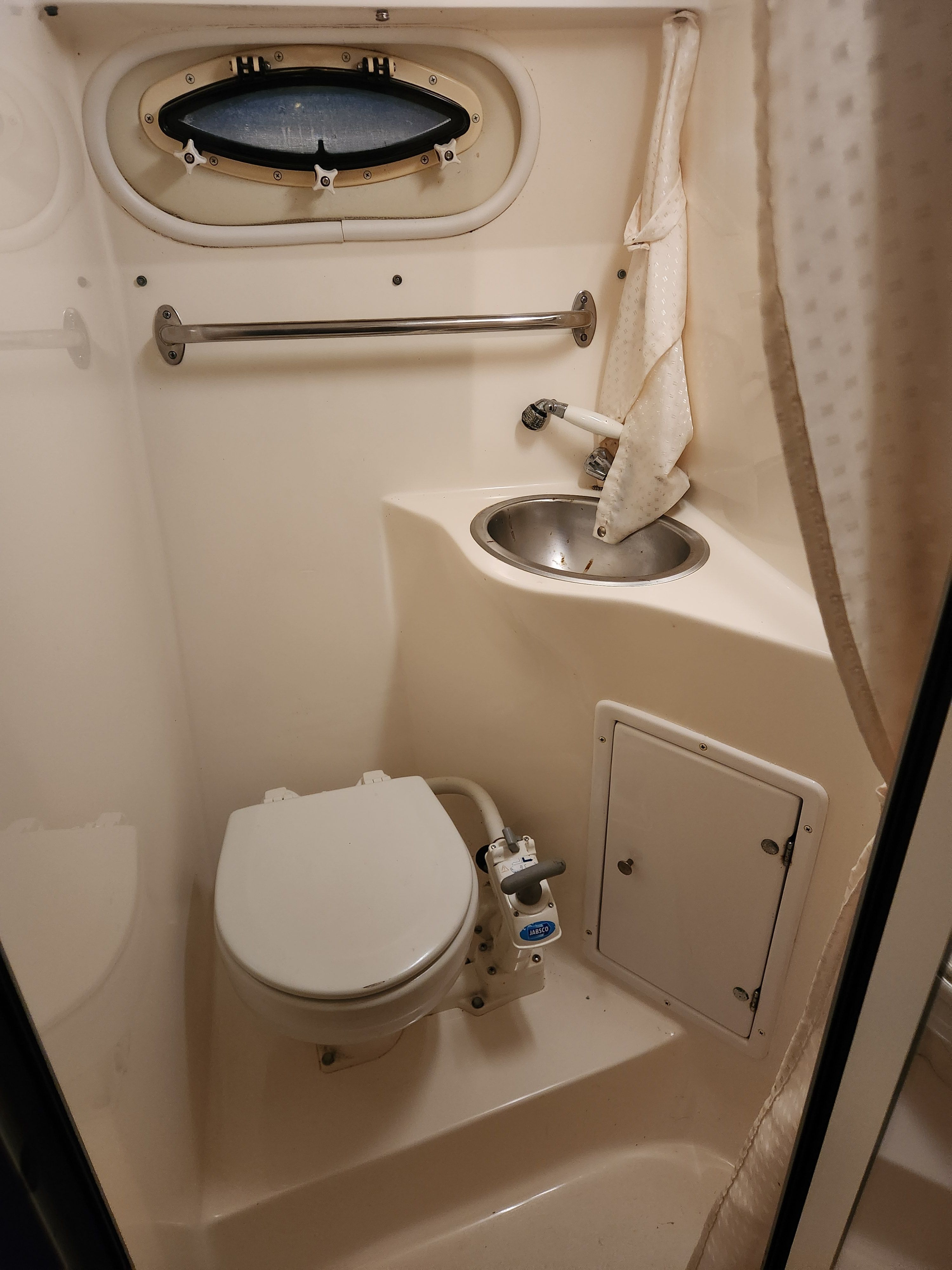 Interior view of a 2006 Rinker 250 EC boat's head compartment.