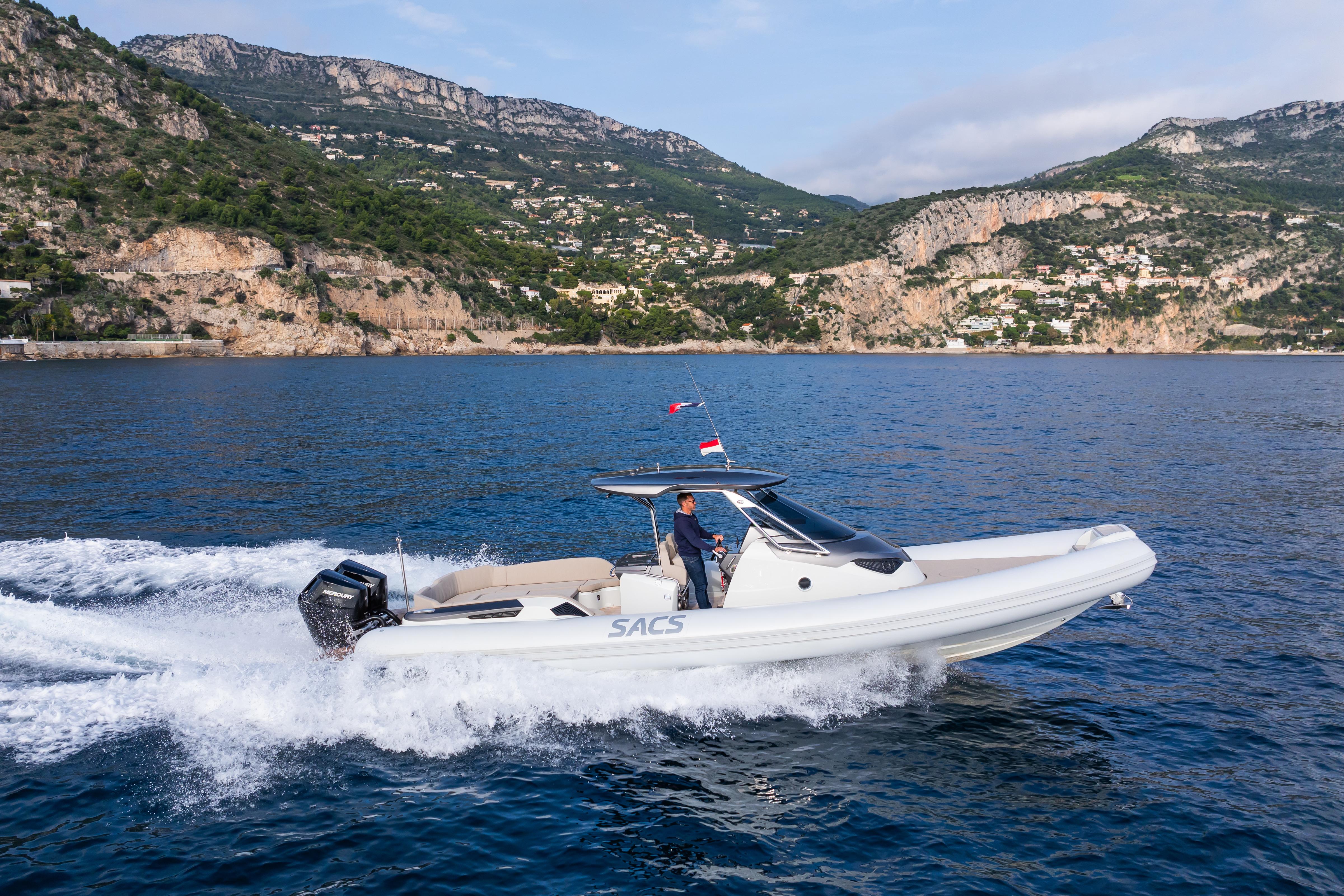 2025 SACS STRIDER 11 OPEN BACK cruising on scenic coastal waters.