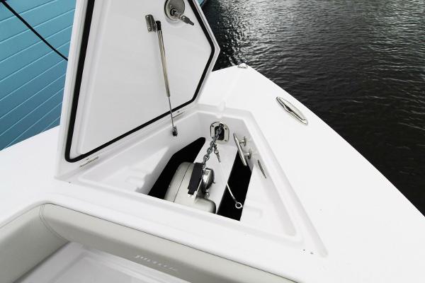 2024 Jupiter 34 HFS boat anchor compartment open, showing anchor and chain storage.