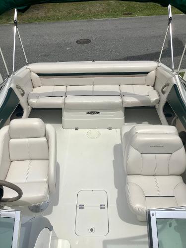 1998 Chaparral 2335 SS boat interior with white leather seating.