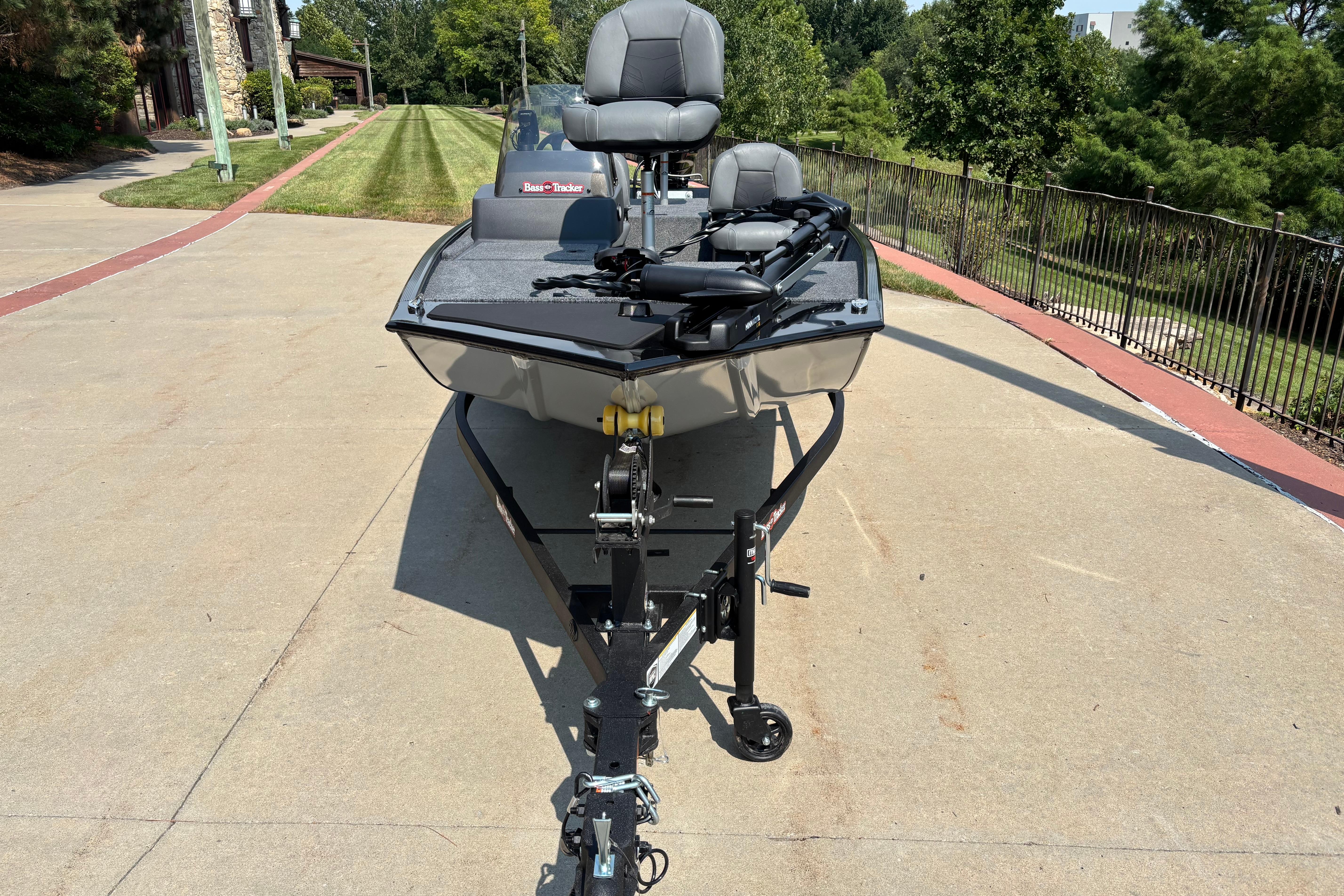 2026 Tracker Bass Tracker Classic XL boat on trailer, parked on driveway.