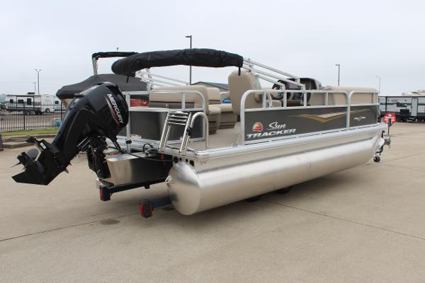2025 Sun Tracker Party Barge 18 DLX pontoon boat with Mercury outboard motor.