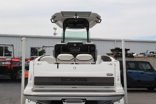 2023 Scarab 255 Open ID boat, rear view, in a storage yard.