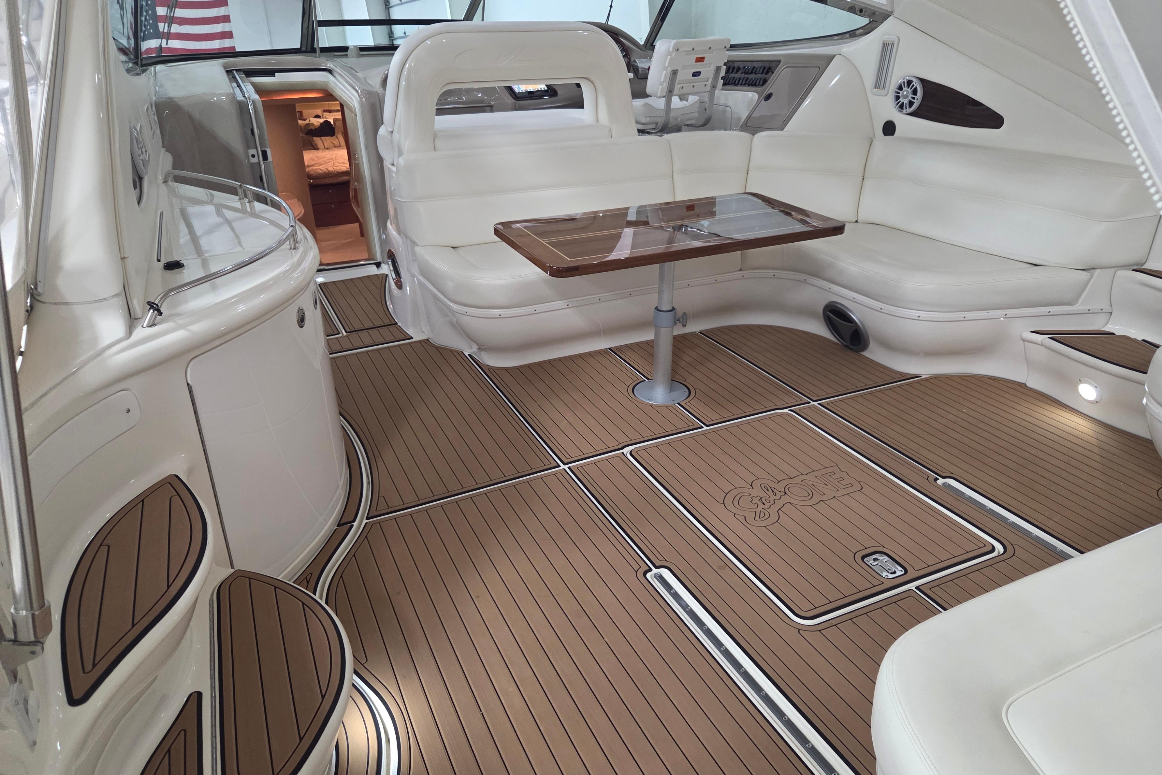 Luxurious interior of a 2000 Sea Ray Sundancer 540 yacht with elegant seating and wood flooring.