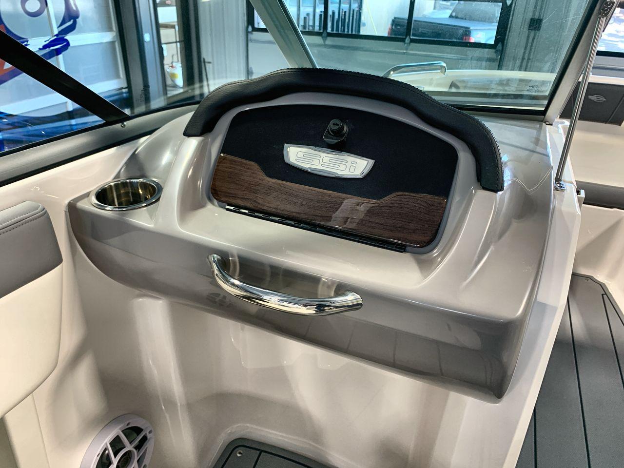 2025 Chaparral 21 SSi boat interior with sleek dashboard and cup holder.