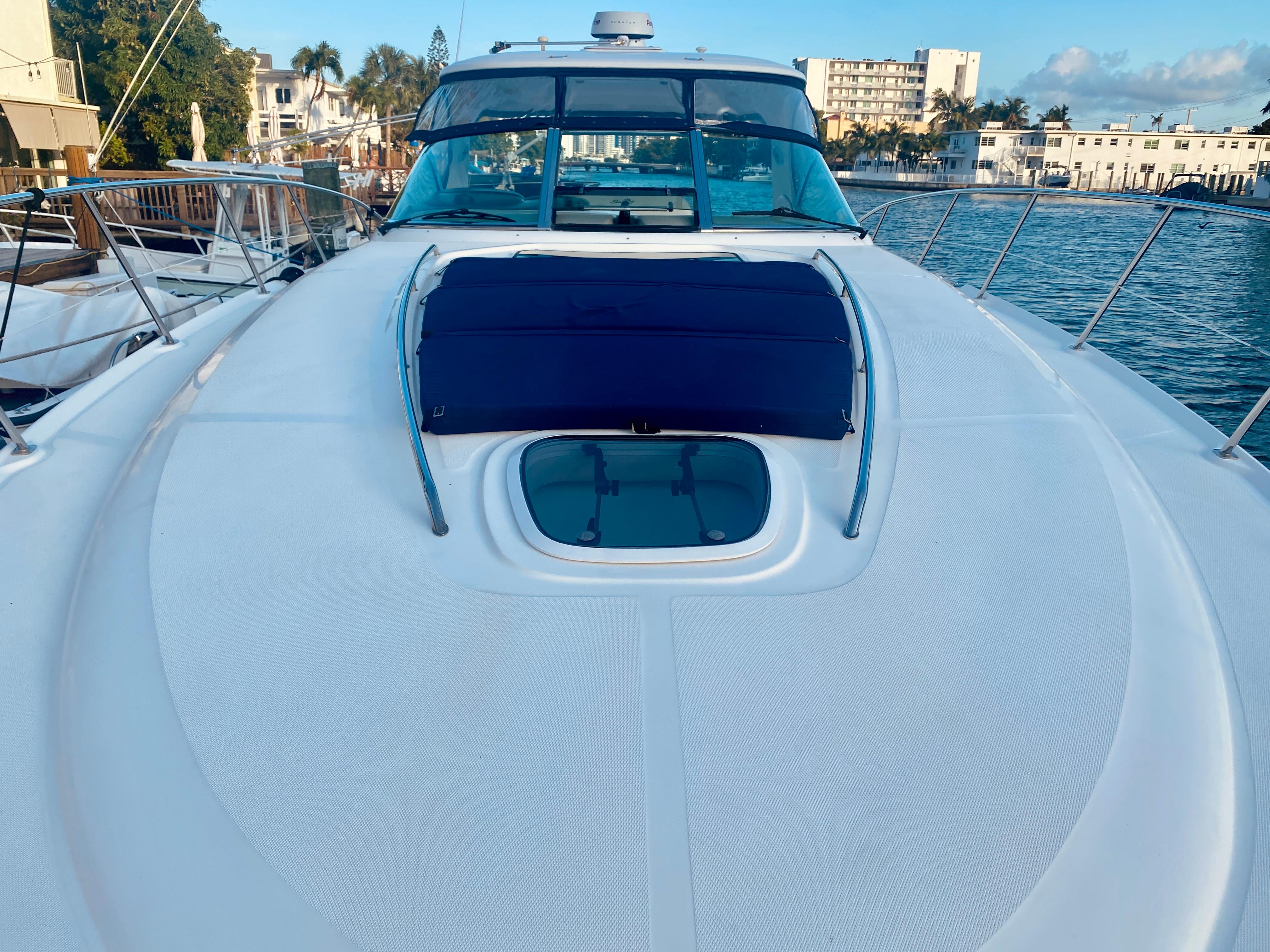 2005 Sea Ray 420 Sundancer yacht docked in a marina.