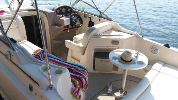 Interior of a 2004 Rinker Fiesta Vee 250 boat on water.
