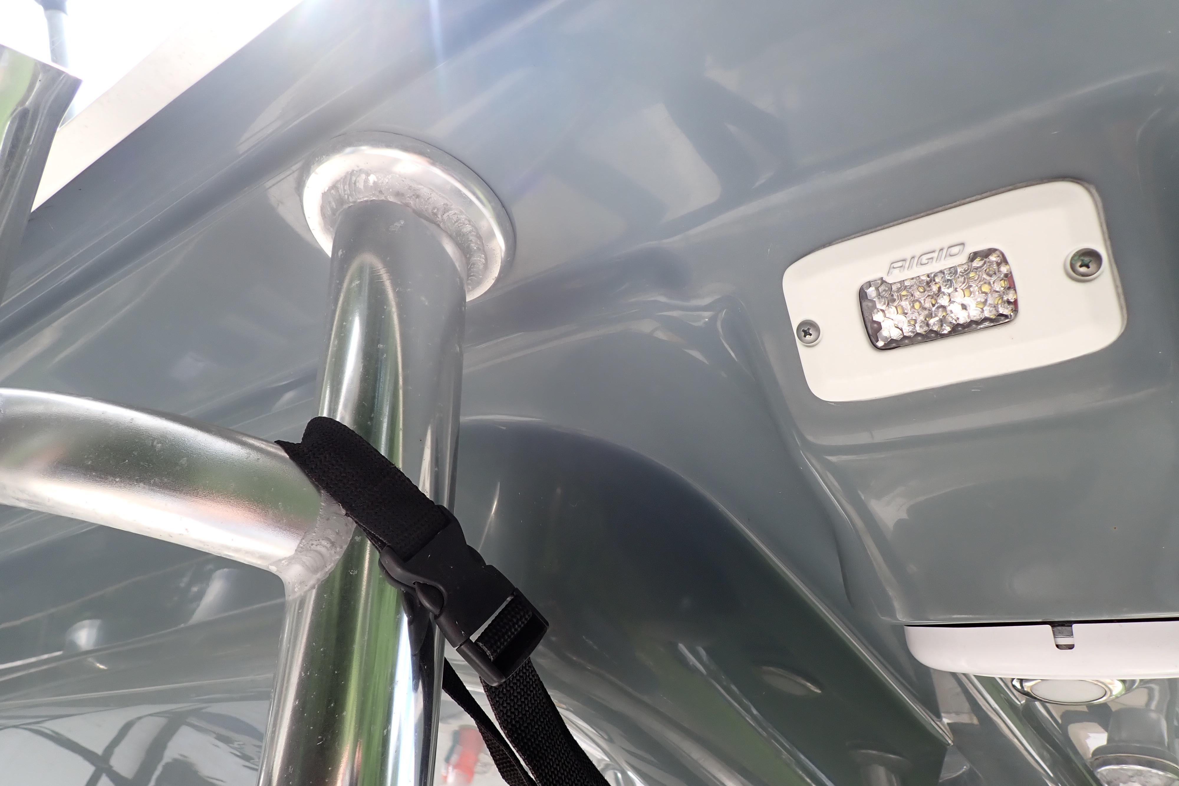 2019 Key West 263 FS boat detail showing metal railing and Rigid LED light.