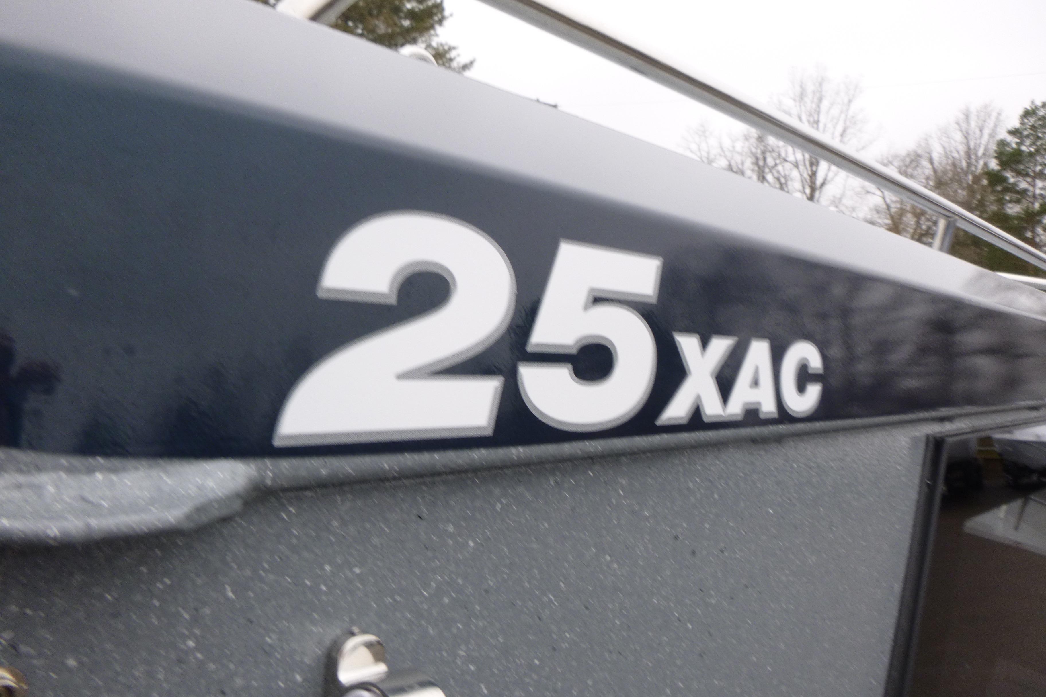2026 KingFisher 25 XAC boat model name on hull.