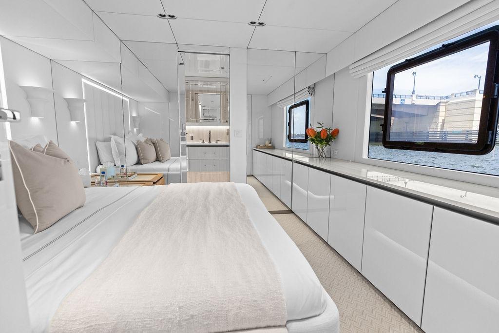 Luxurious interior of 2024 Sunreef 80 Power yacht, featuring elegant bedroom and modern design.