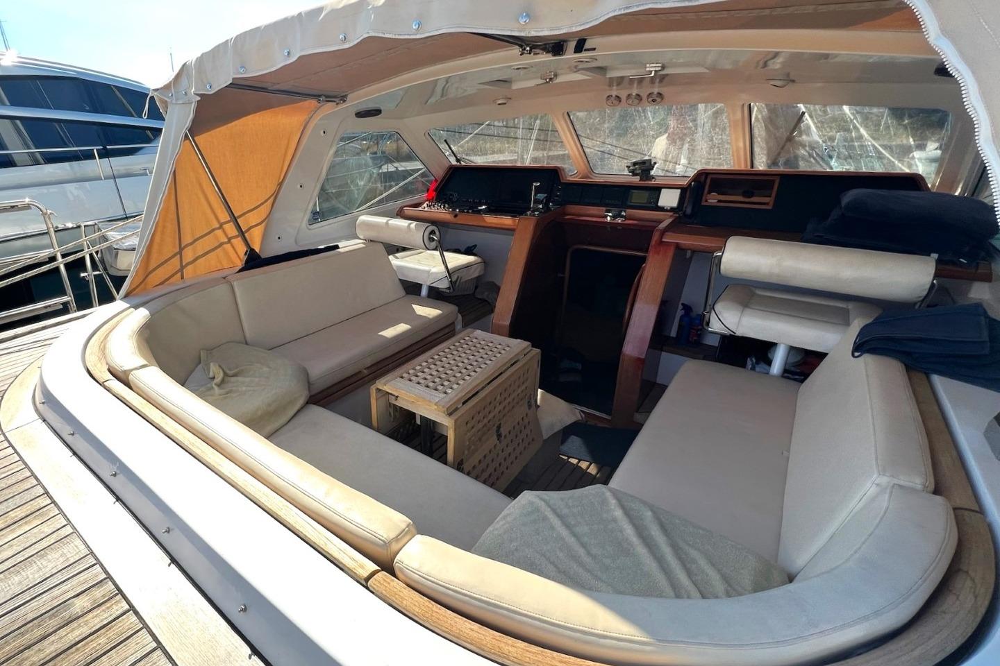 Luxurious 1988 Jongert yacht interior with elegant seating and wooden accents.