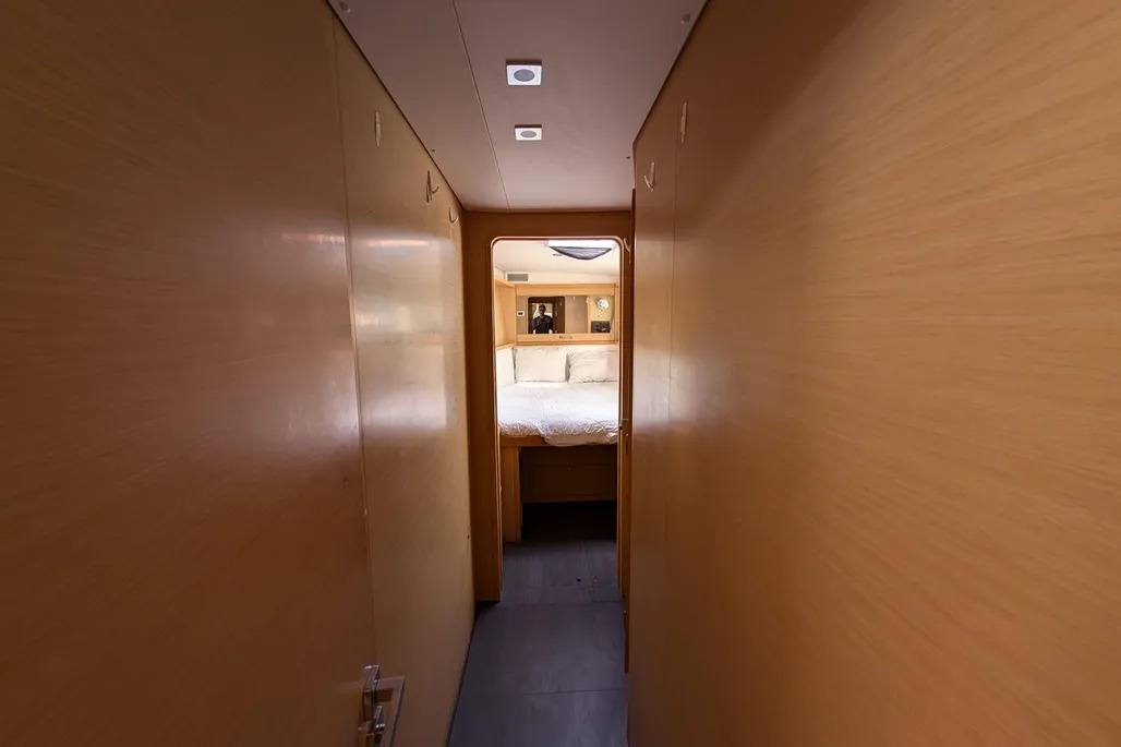 Hallway leading to a cozy bedroom in a 2015 Lagoon 450 F yacht.
