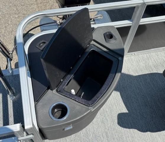2026 Sun Tracker Bass Buggy 18 DLX boat storage compartment with open lid.